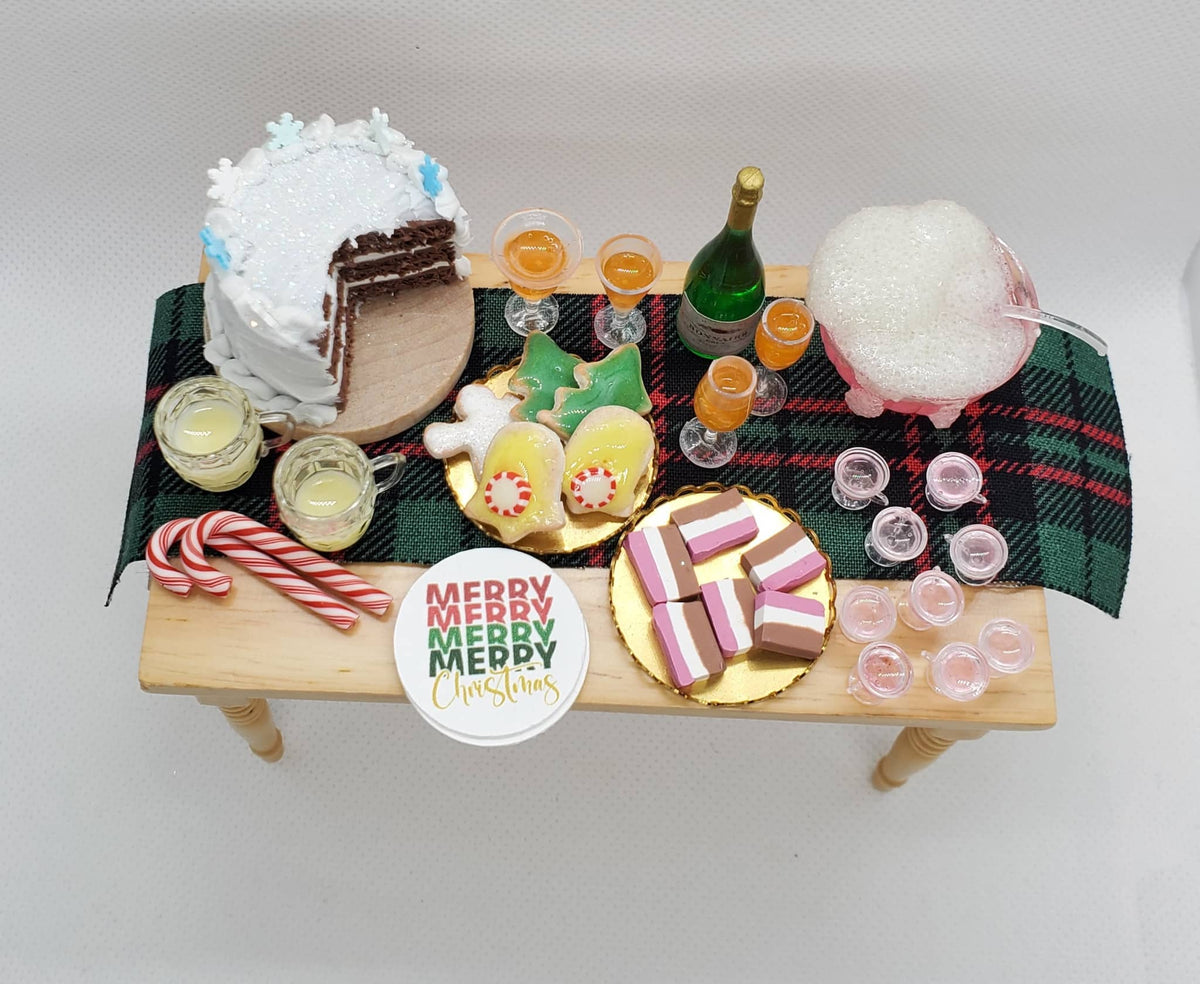 1:12 scale doll furniture holiday table with cake, cookies, candy canes, drinks, and festive decorations