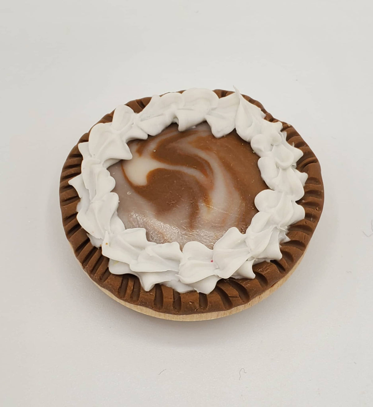 Chef Gina's miniature chocolate Oreo pie with whipped cream on top in a brown crust