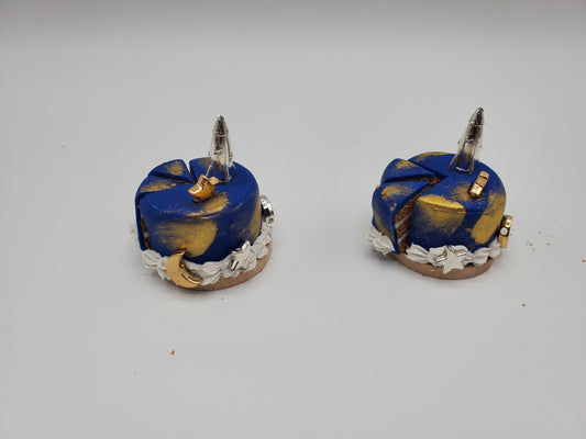 Chef Ginas miniature space cake for dolls with blue and gold frosting and rocket decoration