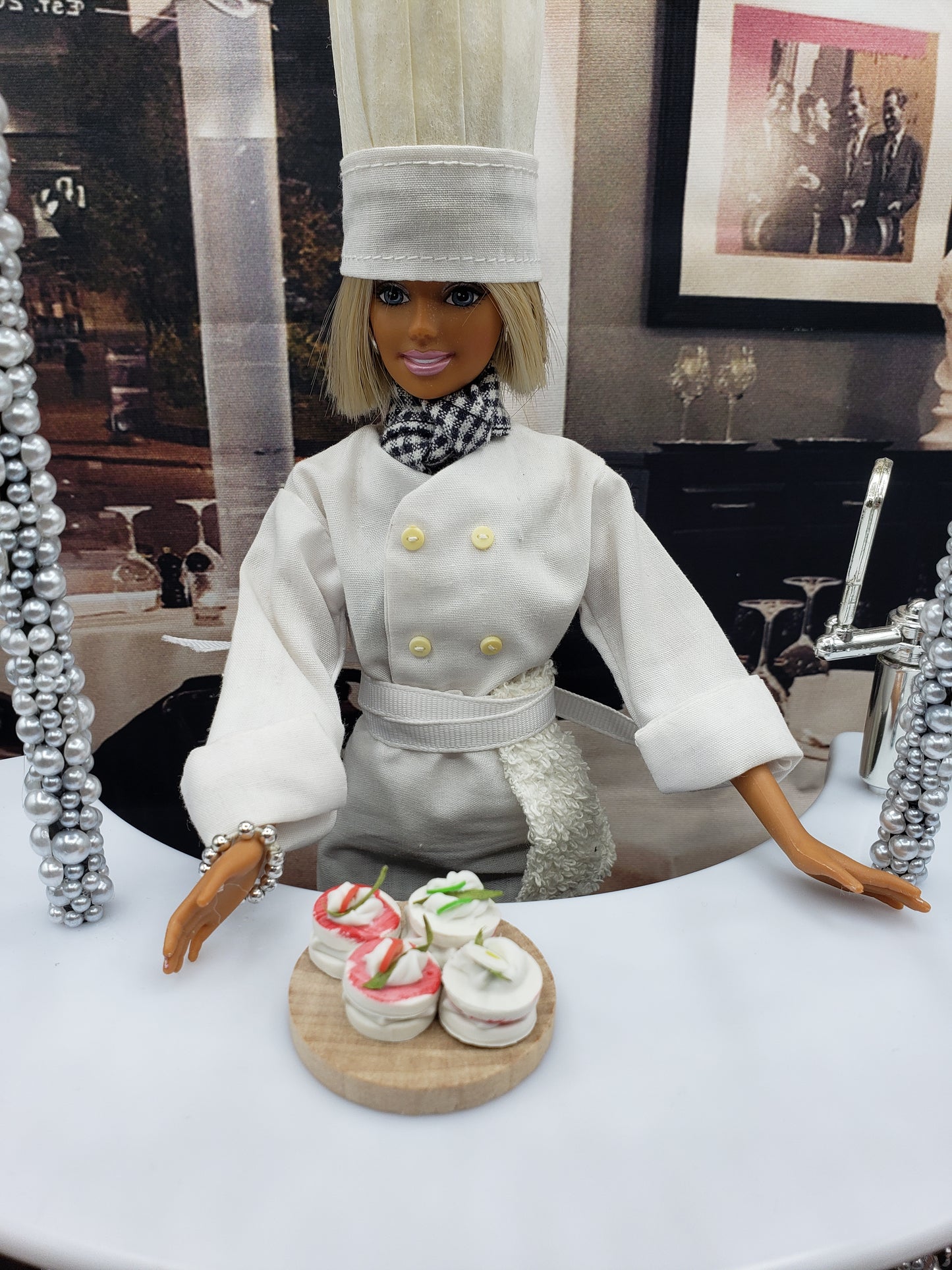 Chef Gina's Mini Food doll presenting a plate of miniature tea sandwiches as hors d'oeuvres