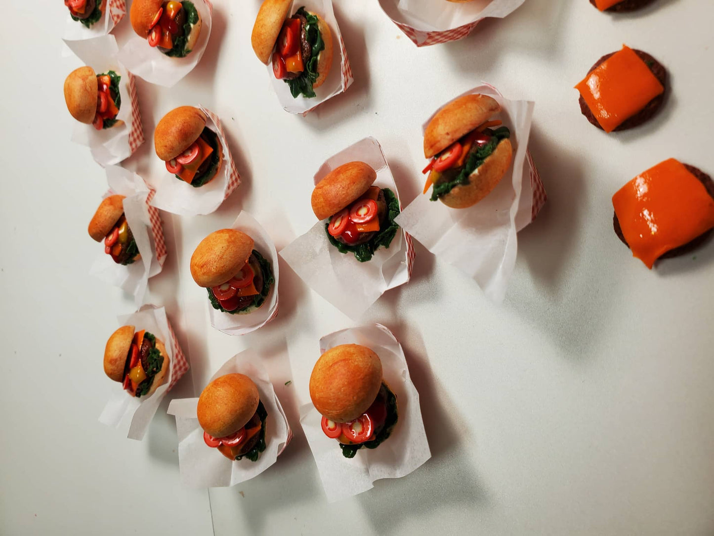 Chef Gina's mini 1:6 scale cheeseburger for dolls with lettuce and tomato in miniature paper trays