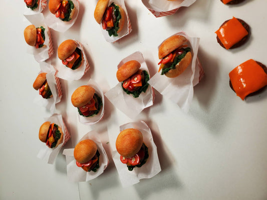 Chef Gina's mini 1:6 scale cheeseburger for dolls with lettuce and tomato in miniature paper trays