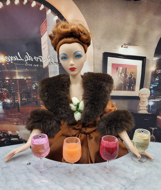Chef Ginas Mini Food pink wine for 1 4th scale displayed in miniature wine glasses with doll in vintage outfit