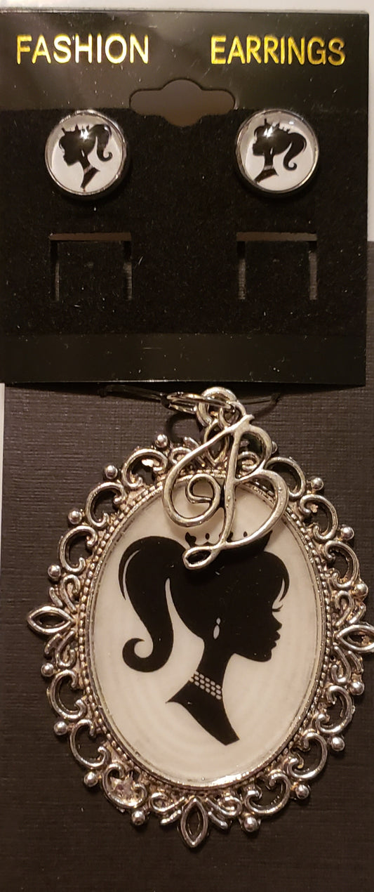 Barbie necklace set featuring black and white silhouette earrings and ornate pendant necklace