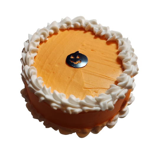 Mini Halloween cakes for dolls with orange frosting and white frosting border