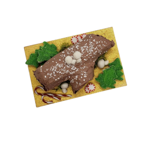 Miniature Christmas Swiss log roll decorated with chocolate frosting and festive candy accents