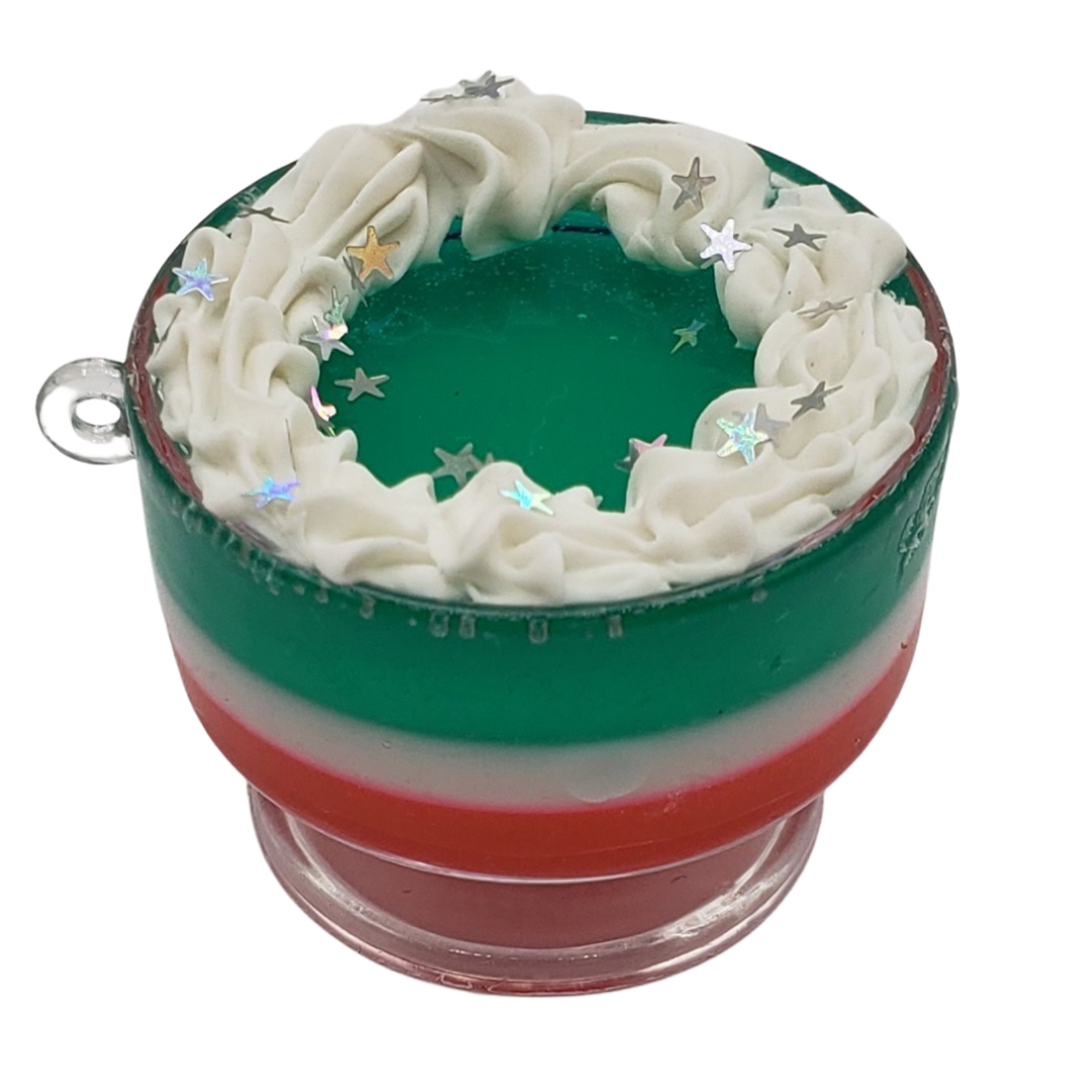 Chef Gina's miniature Christmas trifle toy with red white and green layers topped with white frosting and star sprinkles