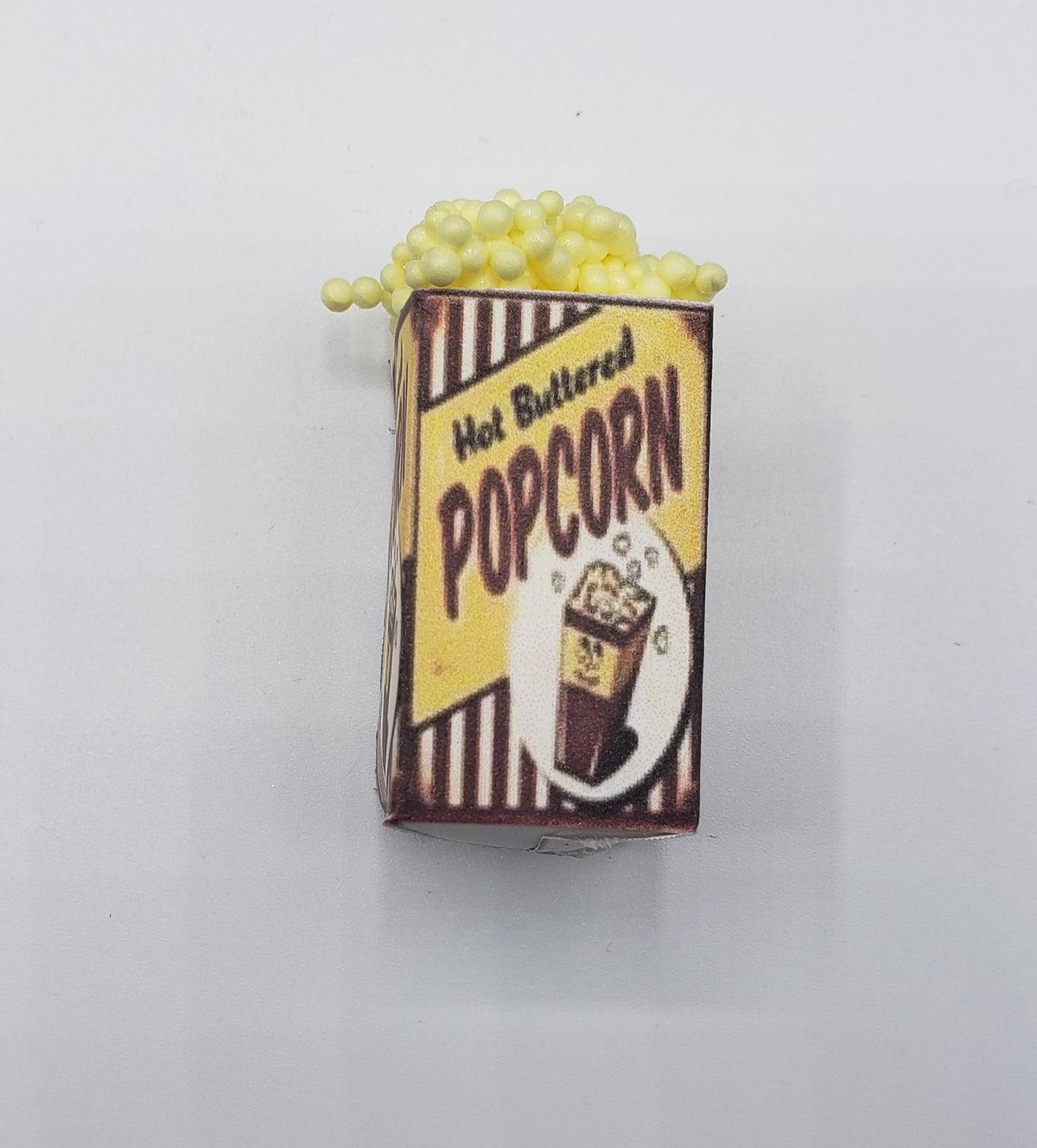 Chef Gina's miniature popcorn tub with hot buttered flavor design in carnival style