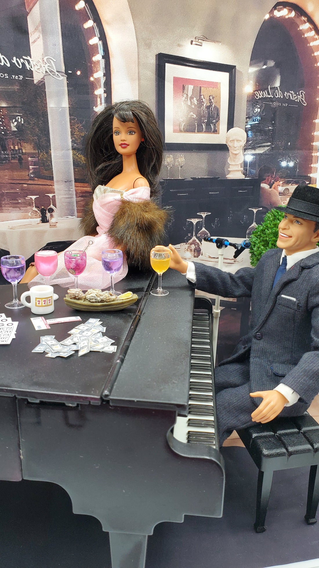 Dolls by the piano drinking