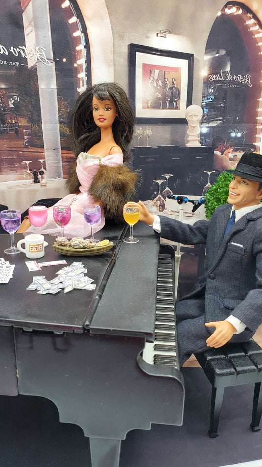 Dolls by the piano drinking
