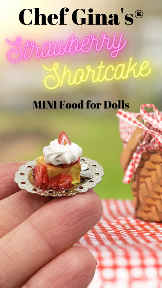 Strawberry shortcake held by fingers showcasing 1:6 scale miniature food craftsmanship by Chef Gina's®