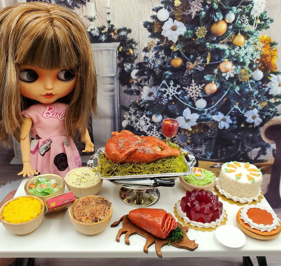 A festive 1:6 scale doll styled for a Thanksgiving feast with Chef Gina’s® turkey dinner and pies.