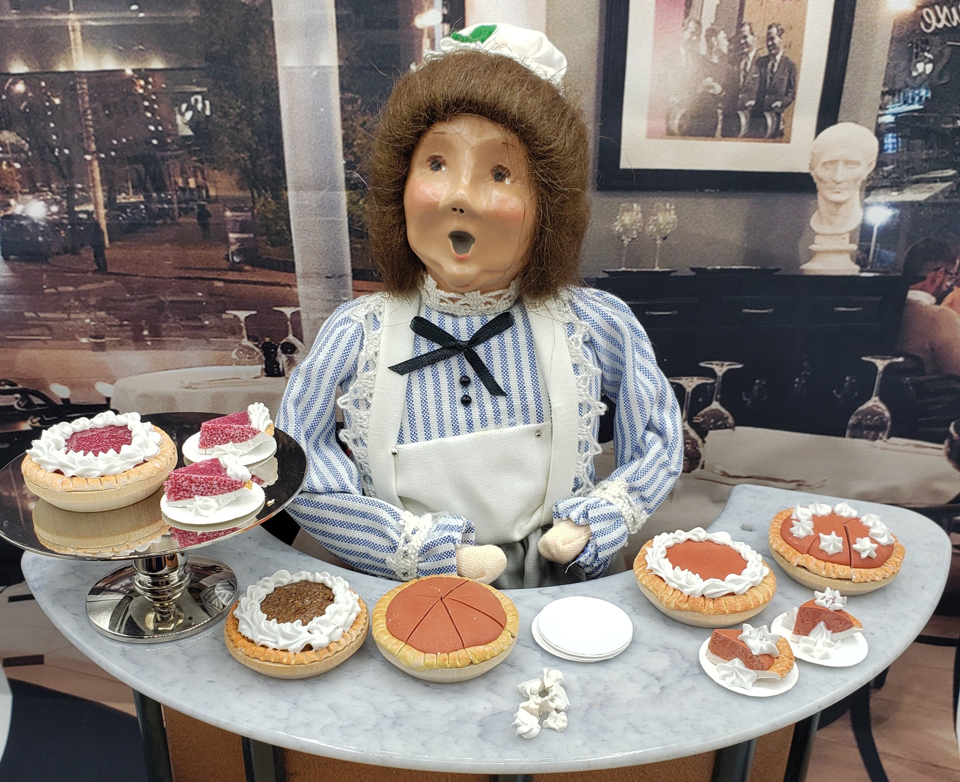 byers choice doll with pies at the bar