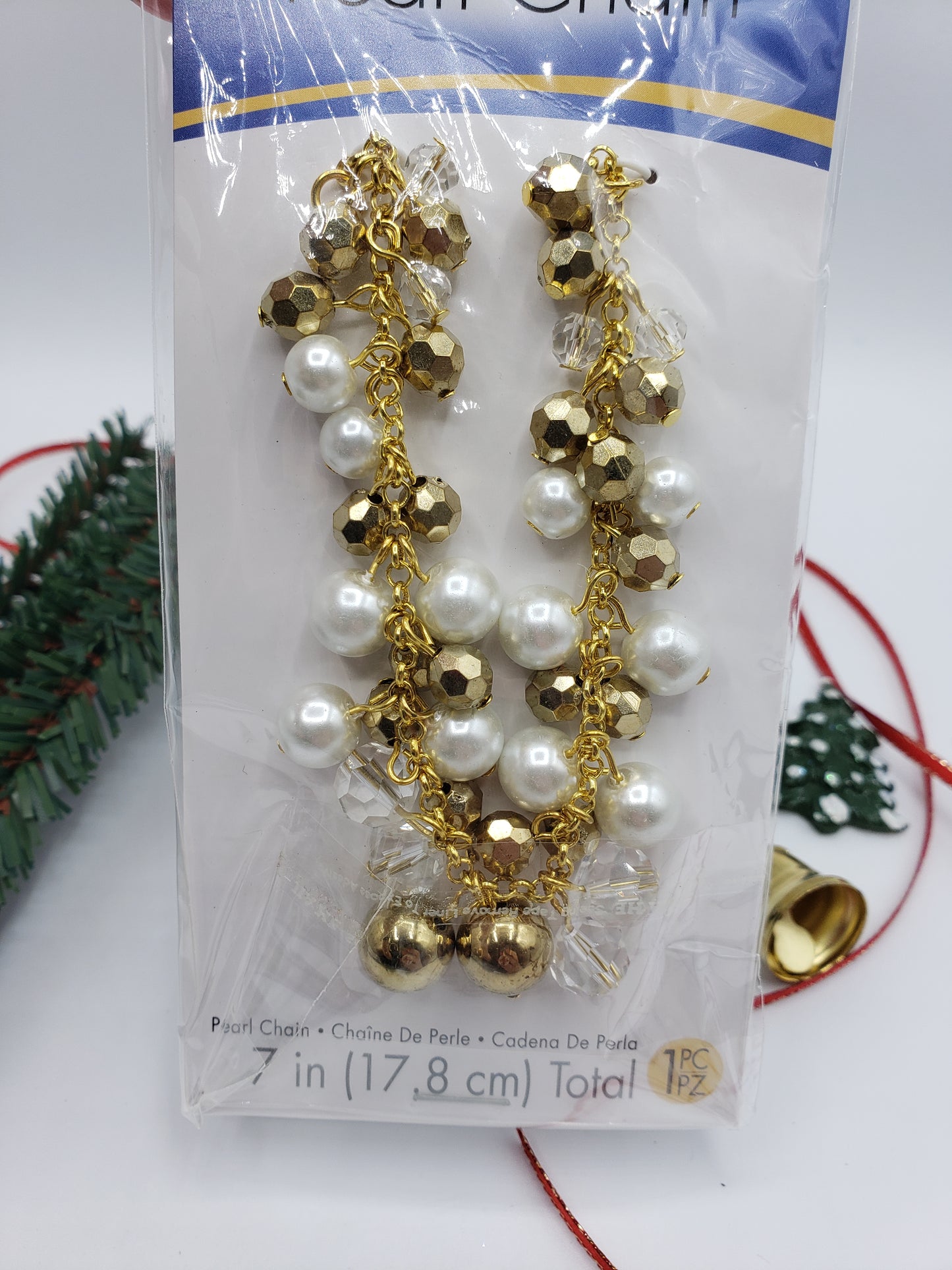 upclose of gold, pearl and clear beads