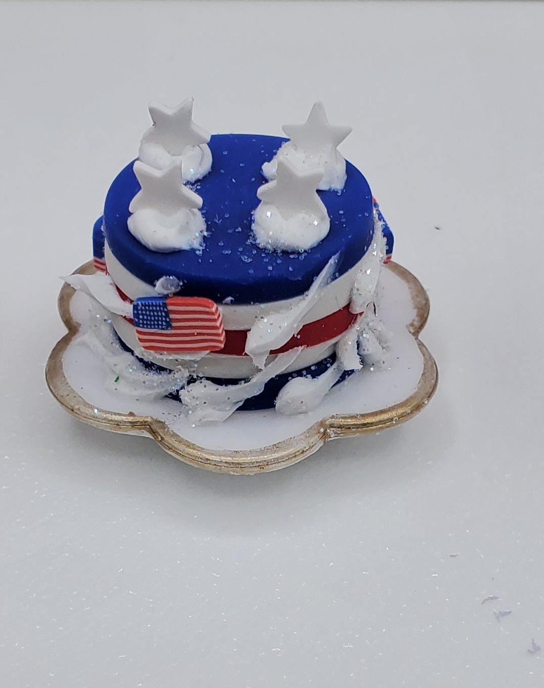 Small cake with American flag design on a white background