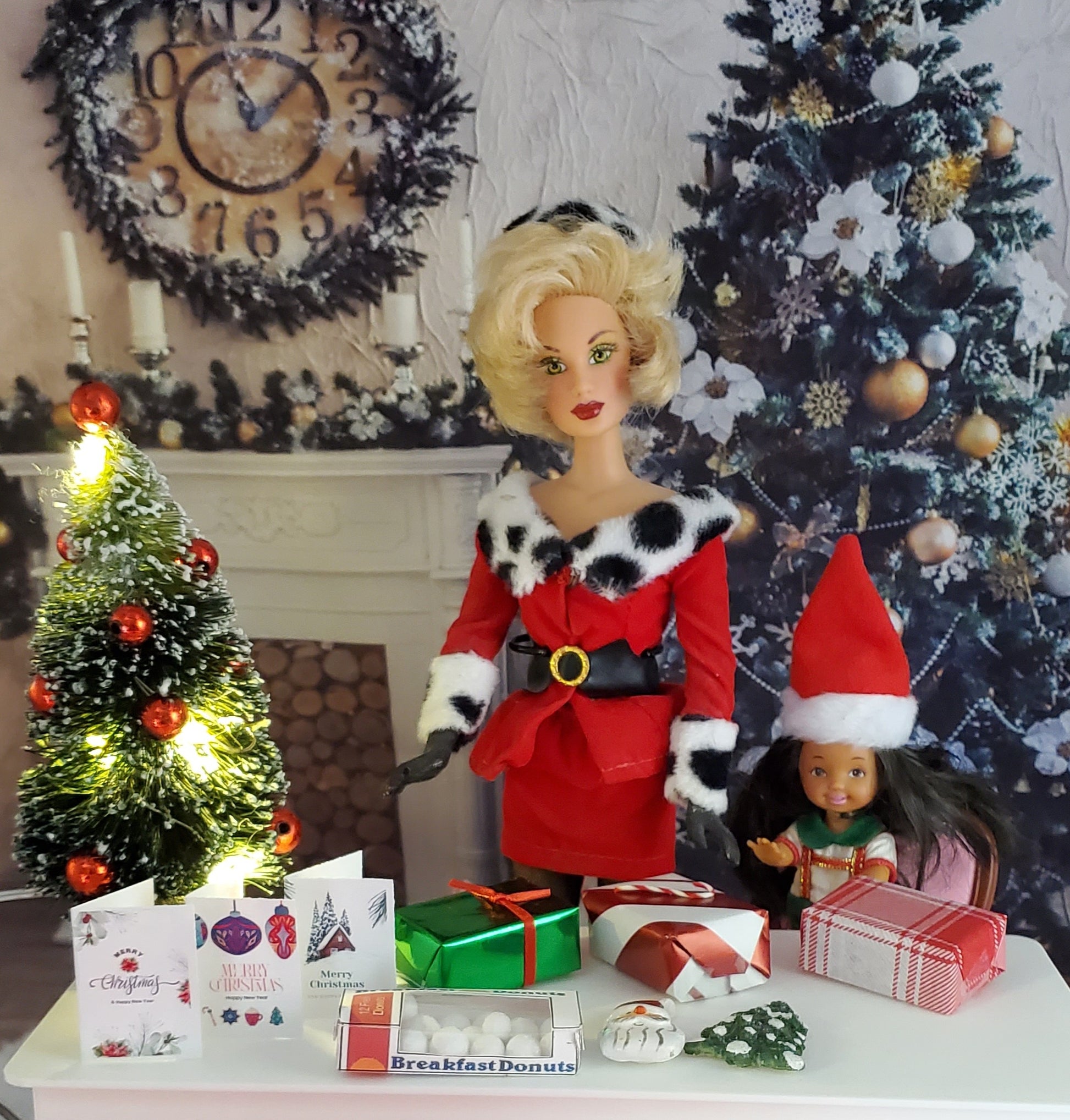 Barbie doll in a Santa outfit with Christmas decorations and tree in the background.