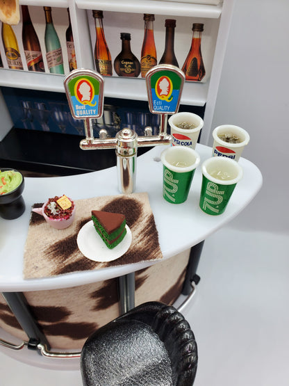 Country western bar set for dolls by Chef Gina's with miniature drinks, desserts, and bar counter