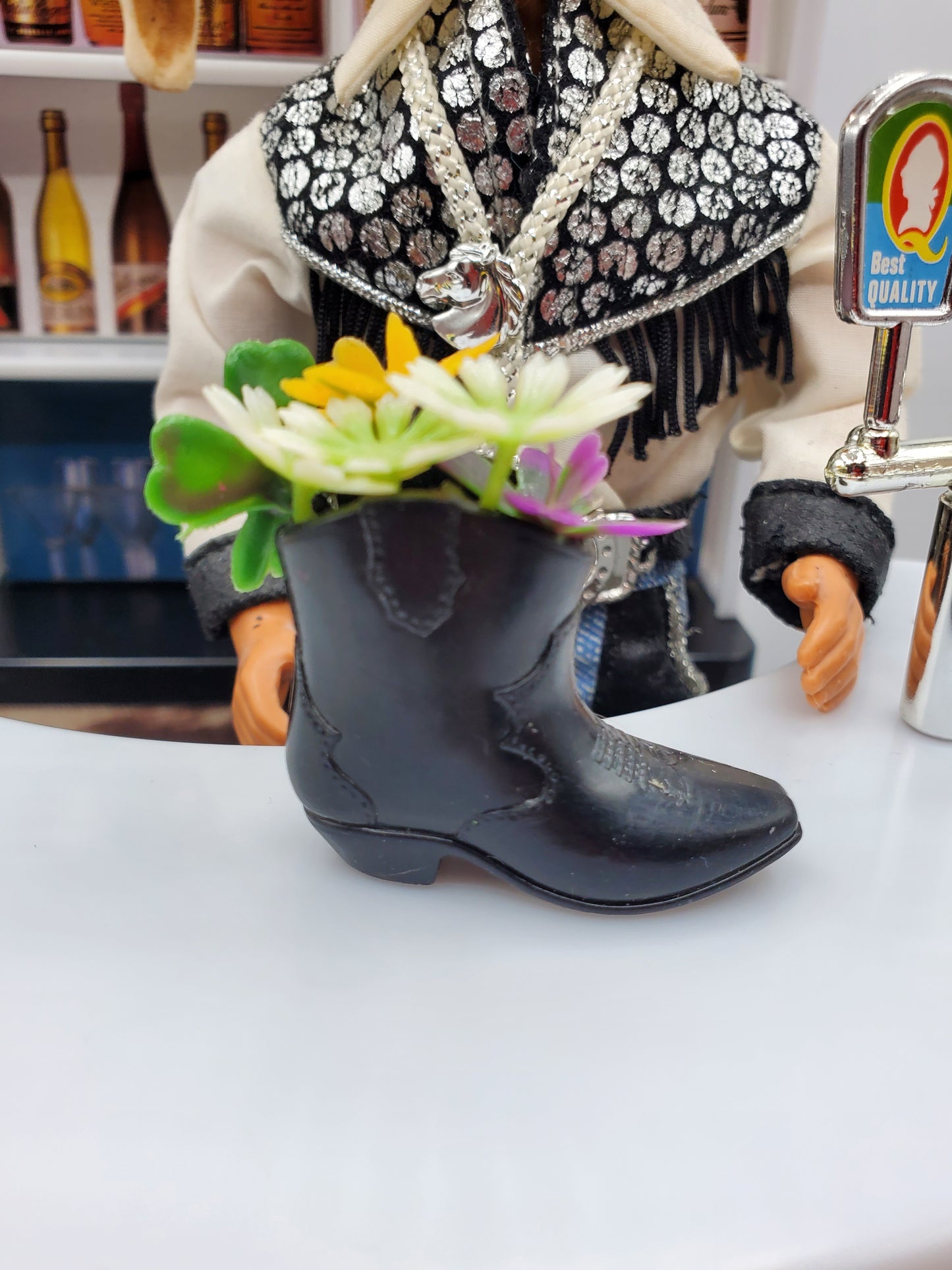 Cowboy boot bouquet for Fashion dolls with colorful flowers arranged in black boot vase