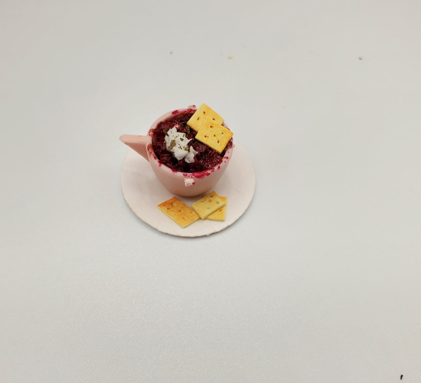 Cup of Chili with Crackers For Dolls miniature food in pink cup with three crackers on white plate