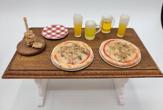 Chef Gina's mini food dollhouse beer and pizza party set with pizzas, beer mugs, plate, and skewers on wooden table