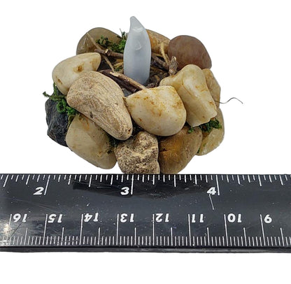 Flickering fire pit showing ruler for size