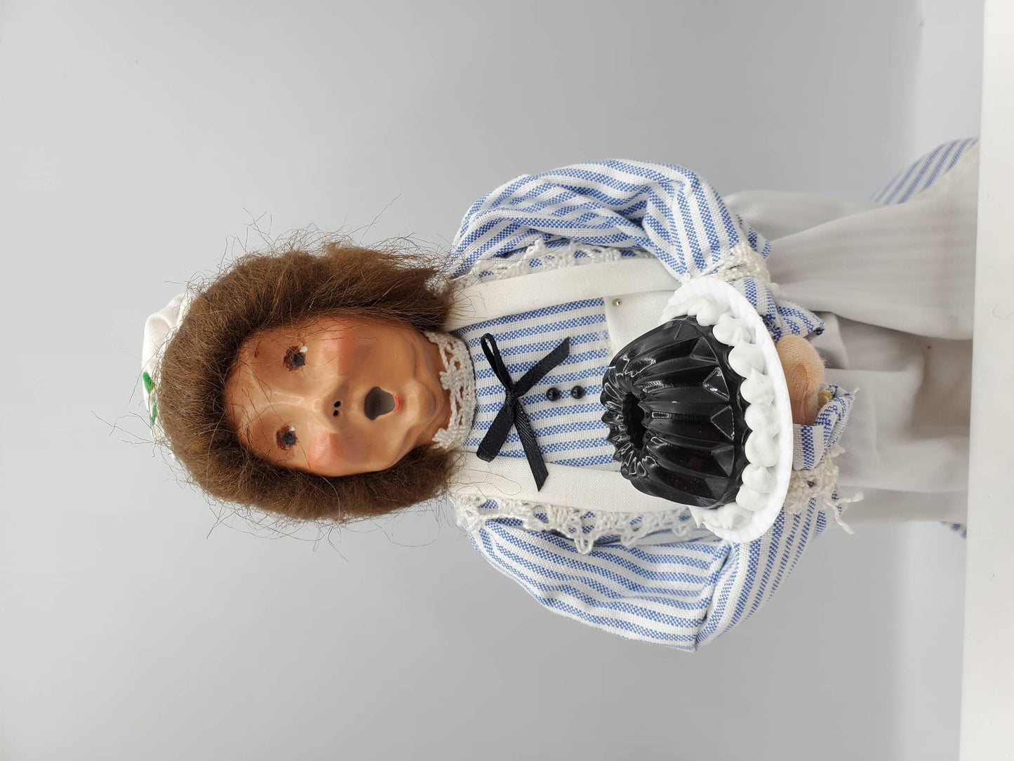 Chef Gina's Mini Food Doll Holding a Classic Jello Mold in a Blue and White Striped Outfit