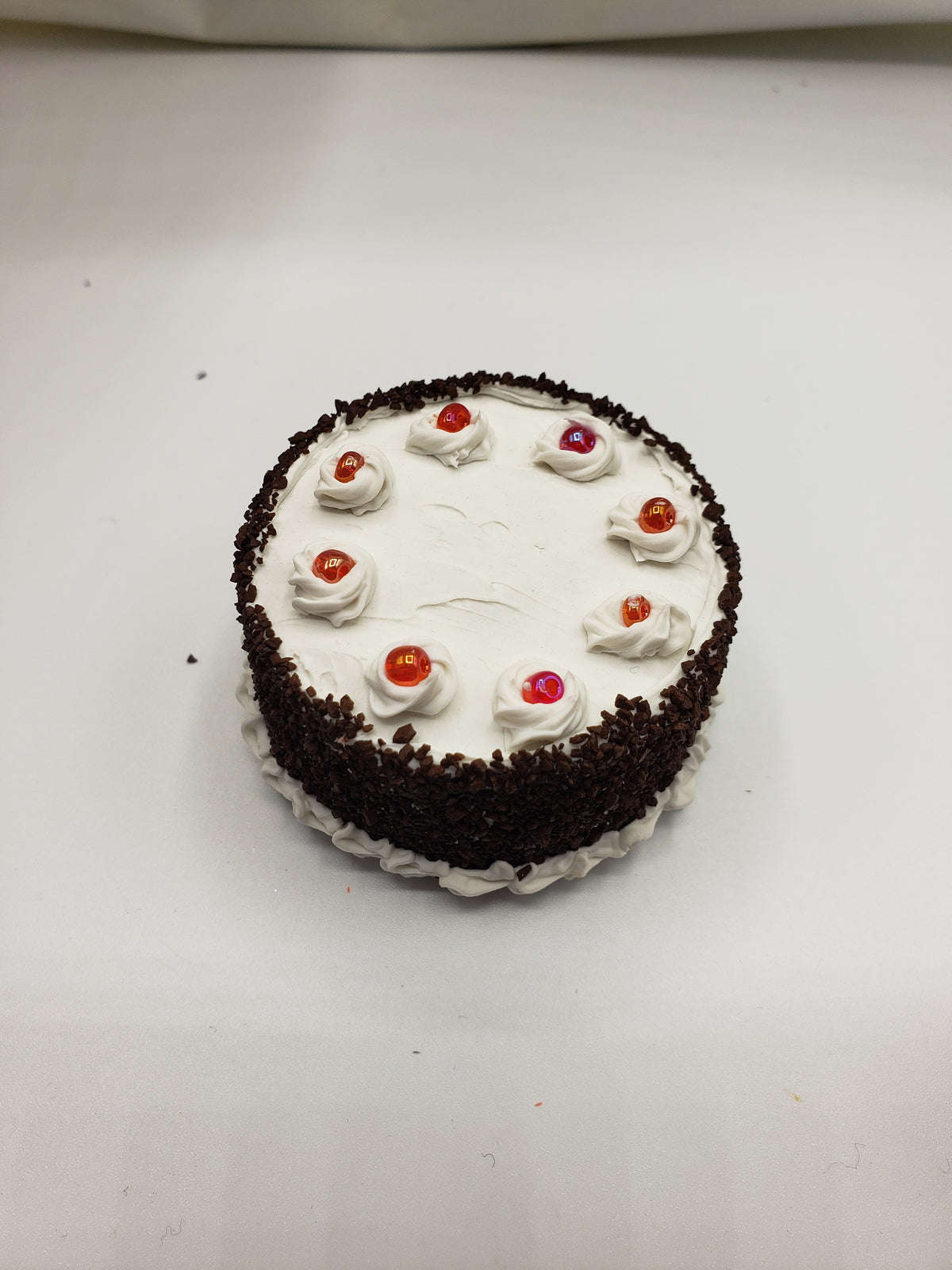 Miniature blackforest cake with whipped cream and colorful toppings from chefginas