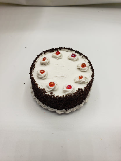 Miniature blackforest cake with whipped cream and colorful toppings from chefginas