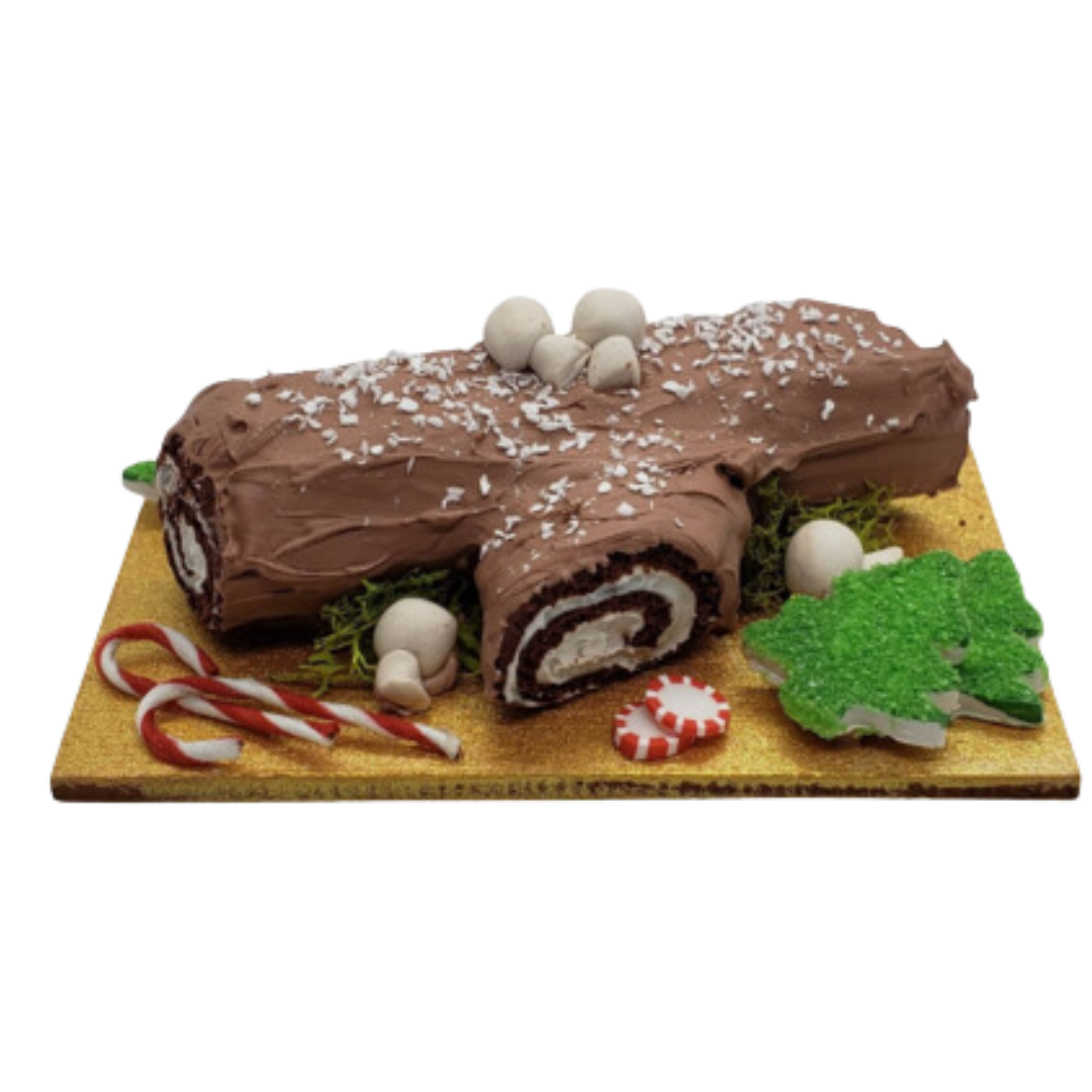 Handcrafted miniature Christmas Swiss log roll with chocolate icing, candy canes, and festive decorations