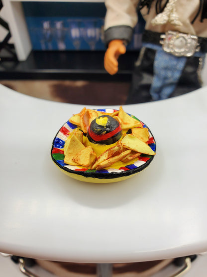 Chef Gina's miniature tortilla chips for dolls on a colorful plate with a small sombrero in the center