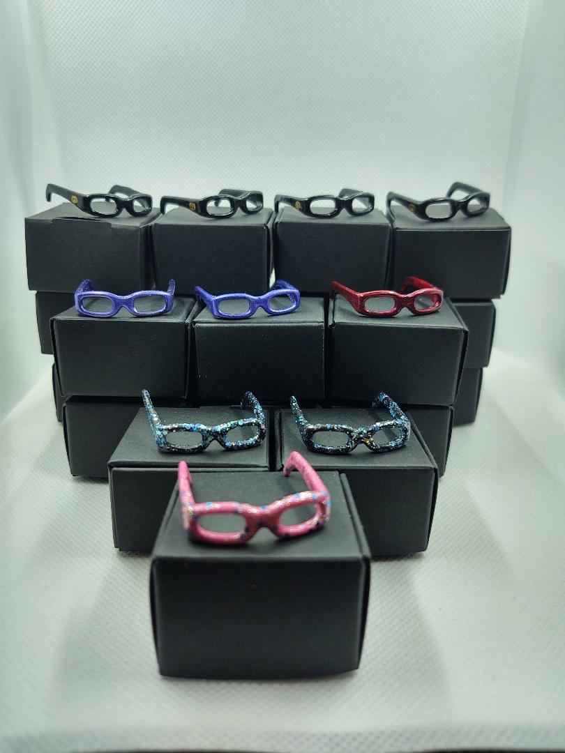 set 4 Barbie eyeglasses with black boxes