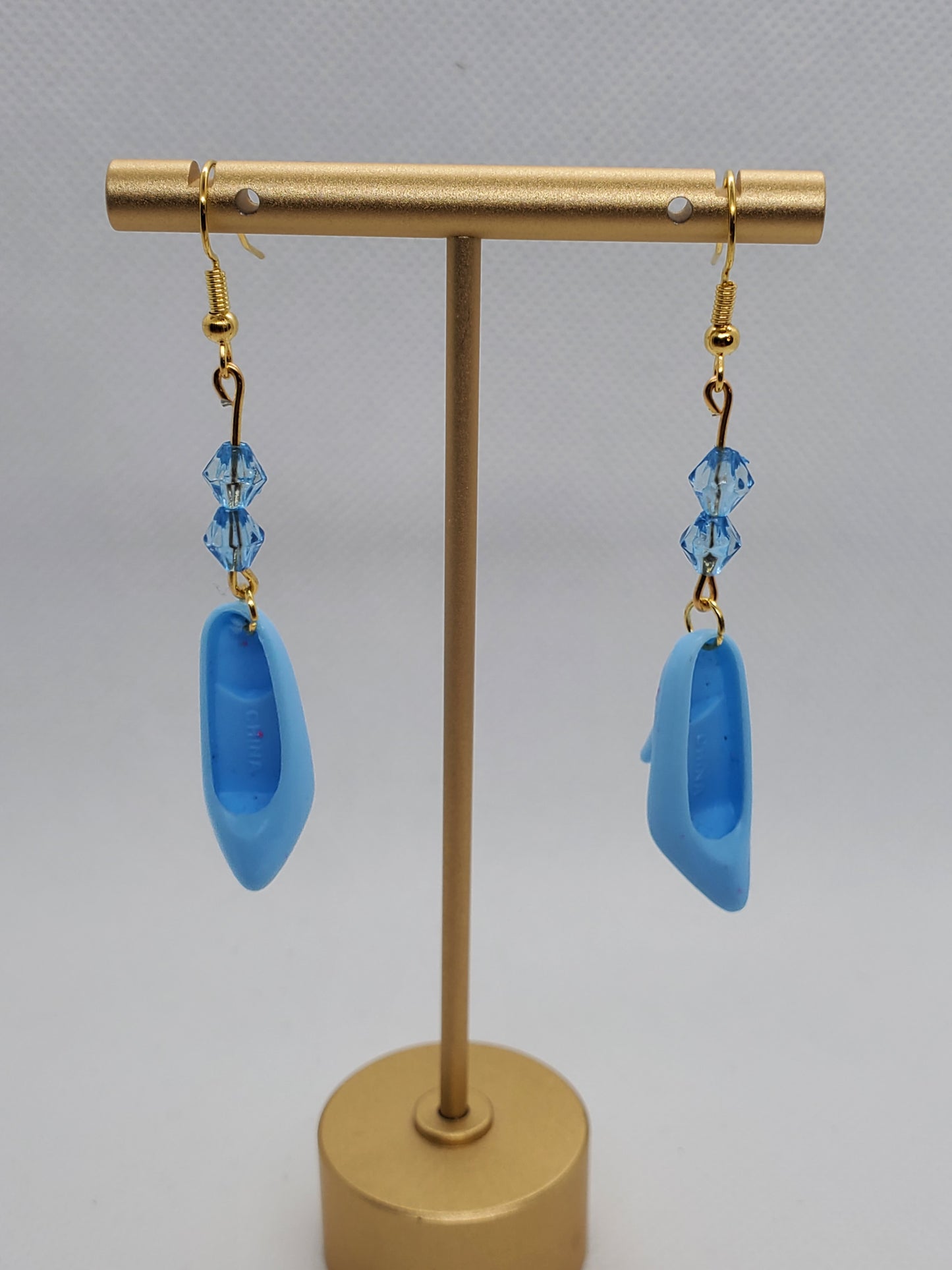Chef Gina's vintage Barbie shoe earrings in blue with gold hooks and blue crystal beads