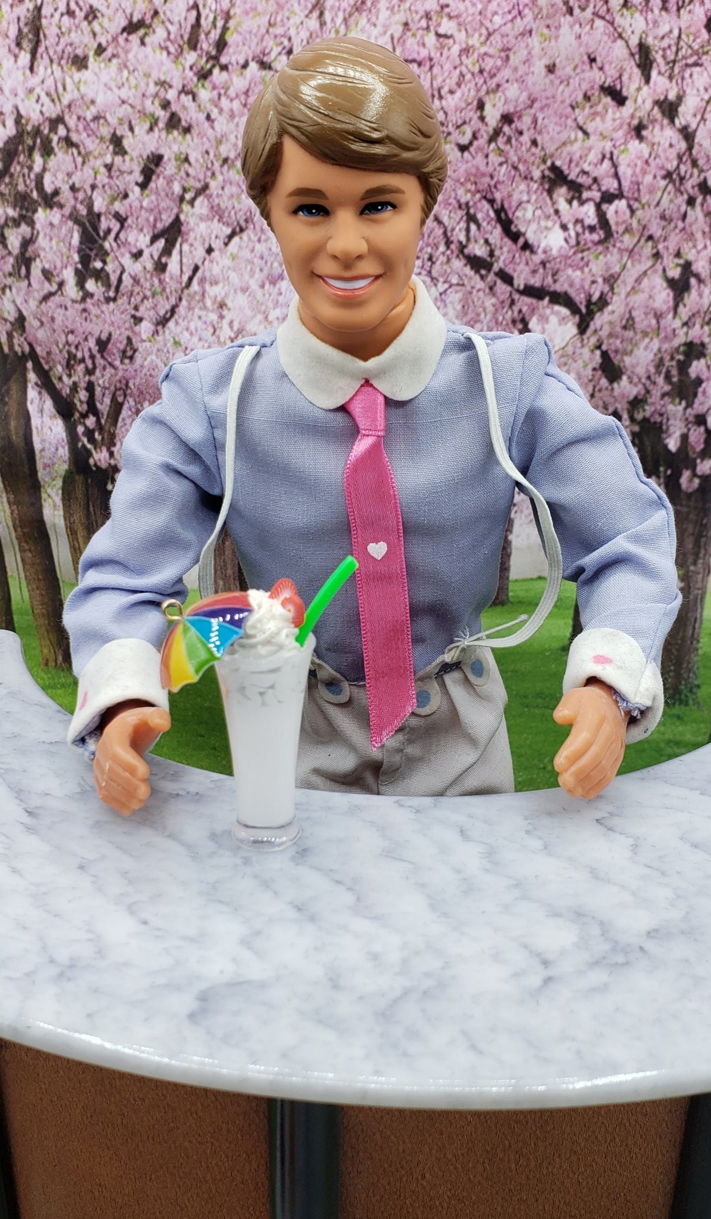 Ken with an umbrella drink