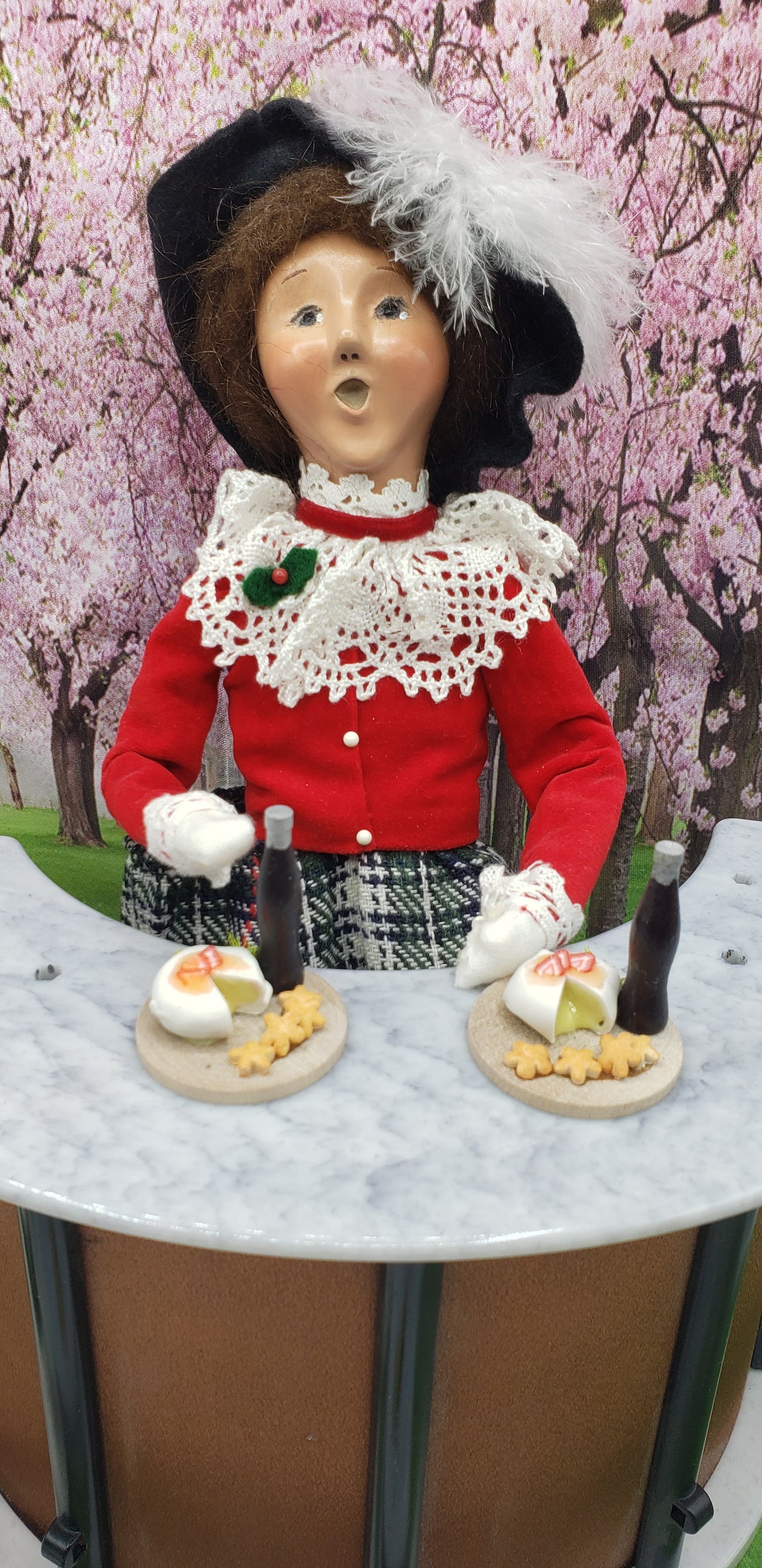 byers' choice doll with round platters
