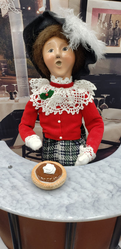 Byers choice doll with a classic boston crea pie